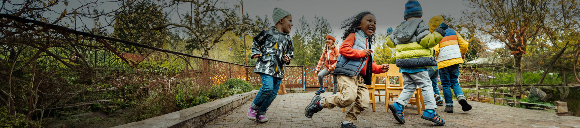 Children playing outside, featuring kids' shoes from KEEN Footwear