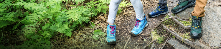 Kids on forest path with roots in new Wanduro shoes