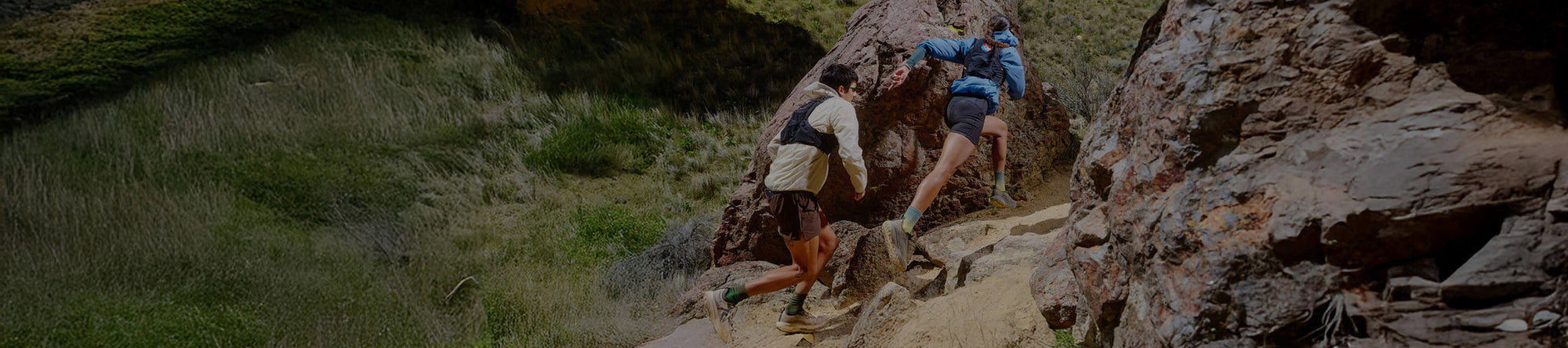 People with dog walking on dirt trail with new Zionic Mid Hiking shoes