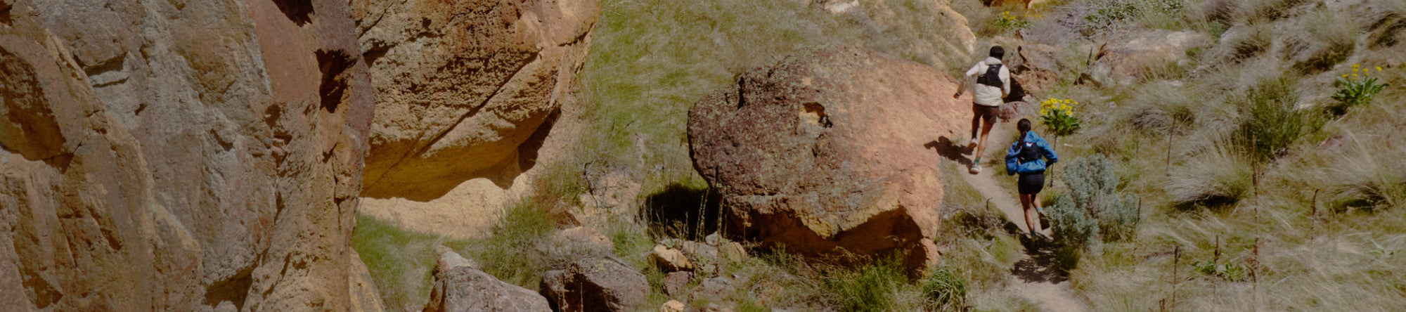 People wearing Zionic hiking boots, on a rocky terrain