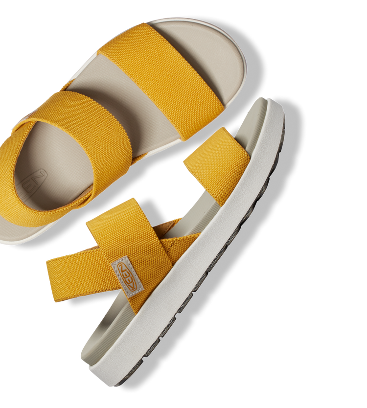 Product shot of yellow Elle Backstrap sandals against white background
