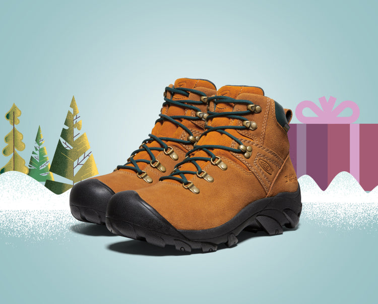 Product shot of men's Pyrenees boots on blue, gradient background