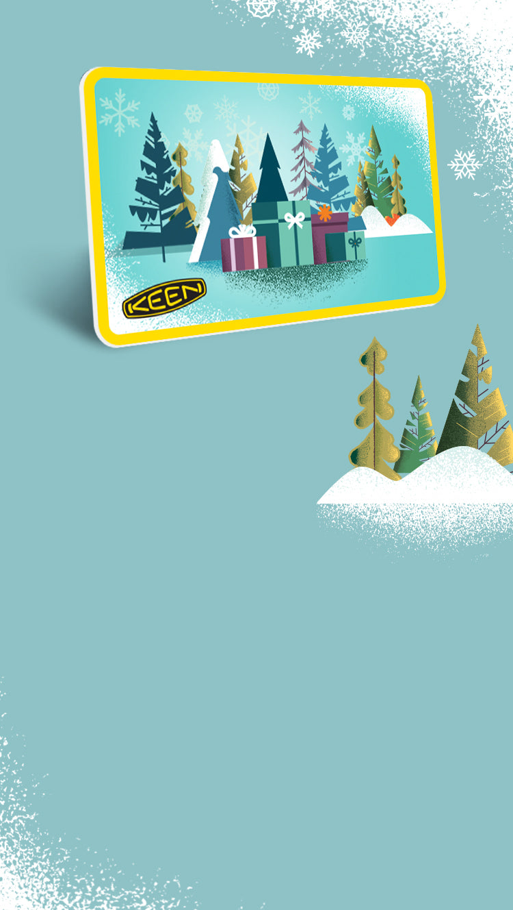 graphic of keen giftcard with presents and wintry trees on it