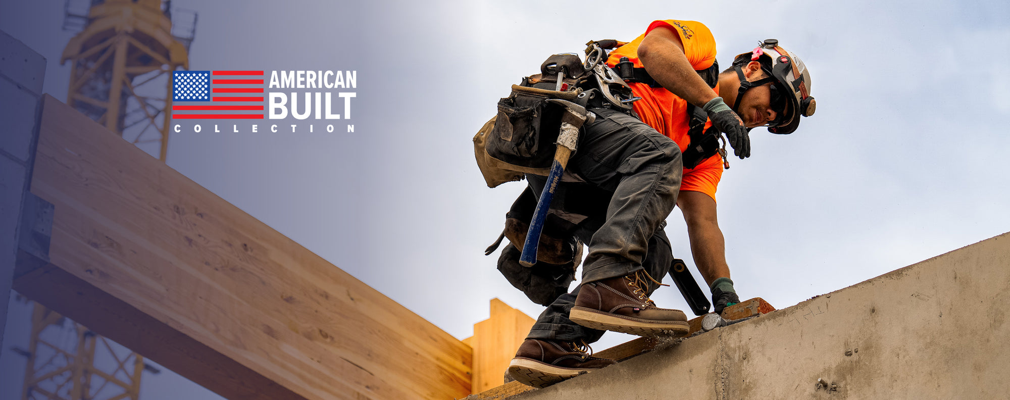 Man on roof wearing Utility work boots and construction belt with embedded american flag and text that reads "American Built Collection".