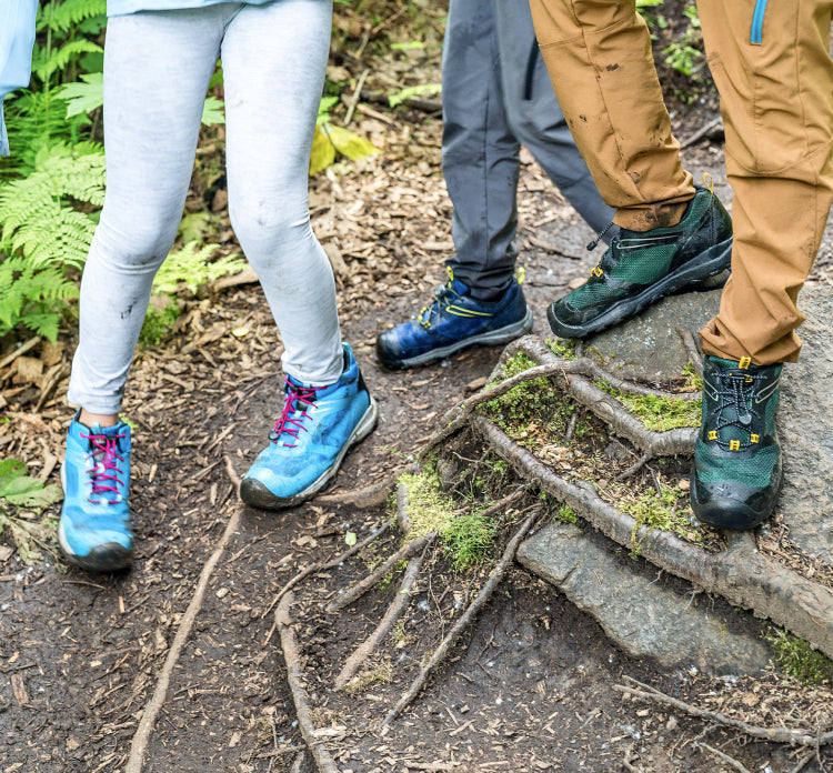 Kids on forest path with roots in new Wanduro shoes