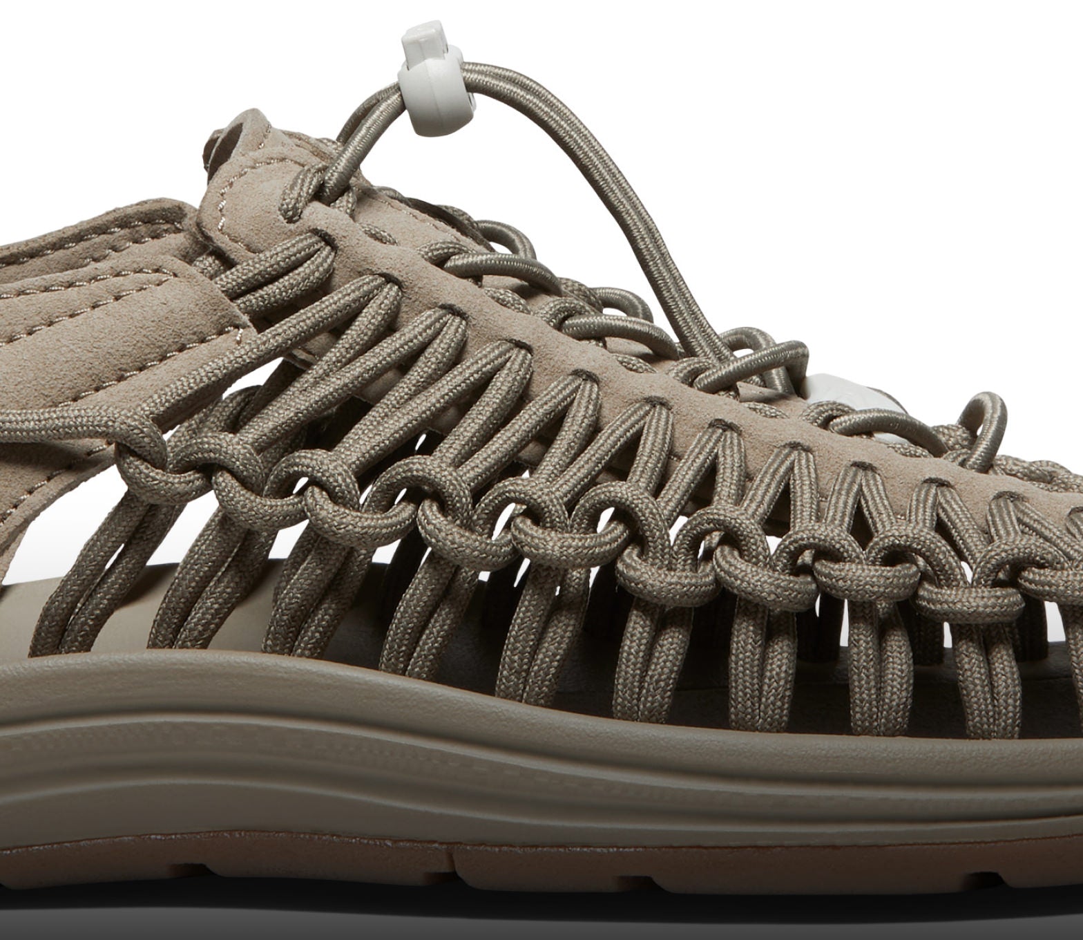 A close-up of a taupe-colored KEEN UNEEK sandal.
