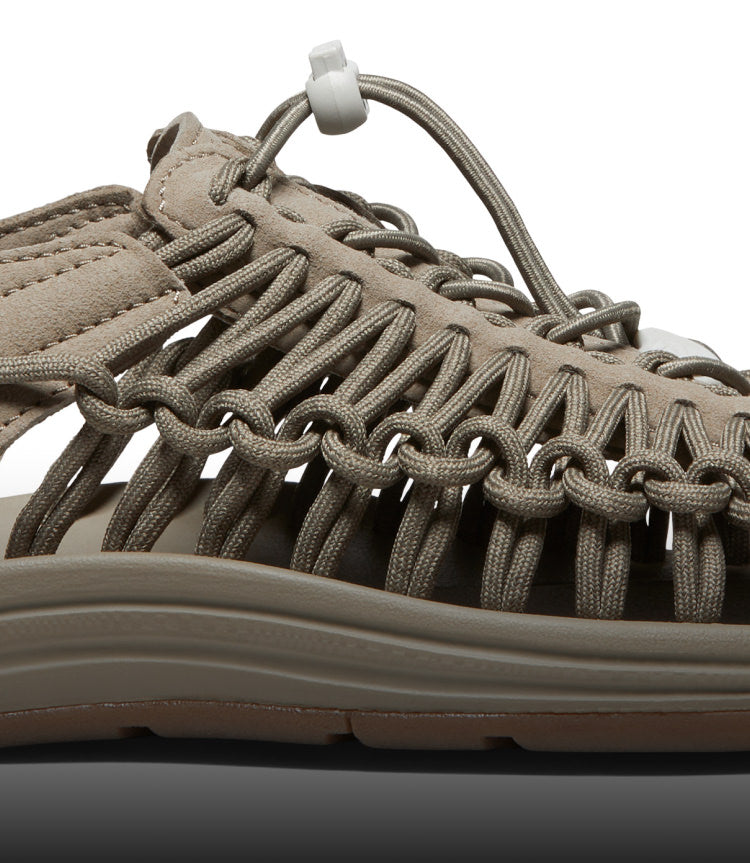 A close-up of a taupe-colored KEEN UNEEK sandal.