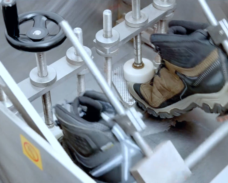 Two Targhee hiking boots going through machine-made flex tests 