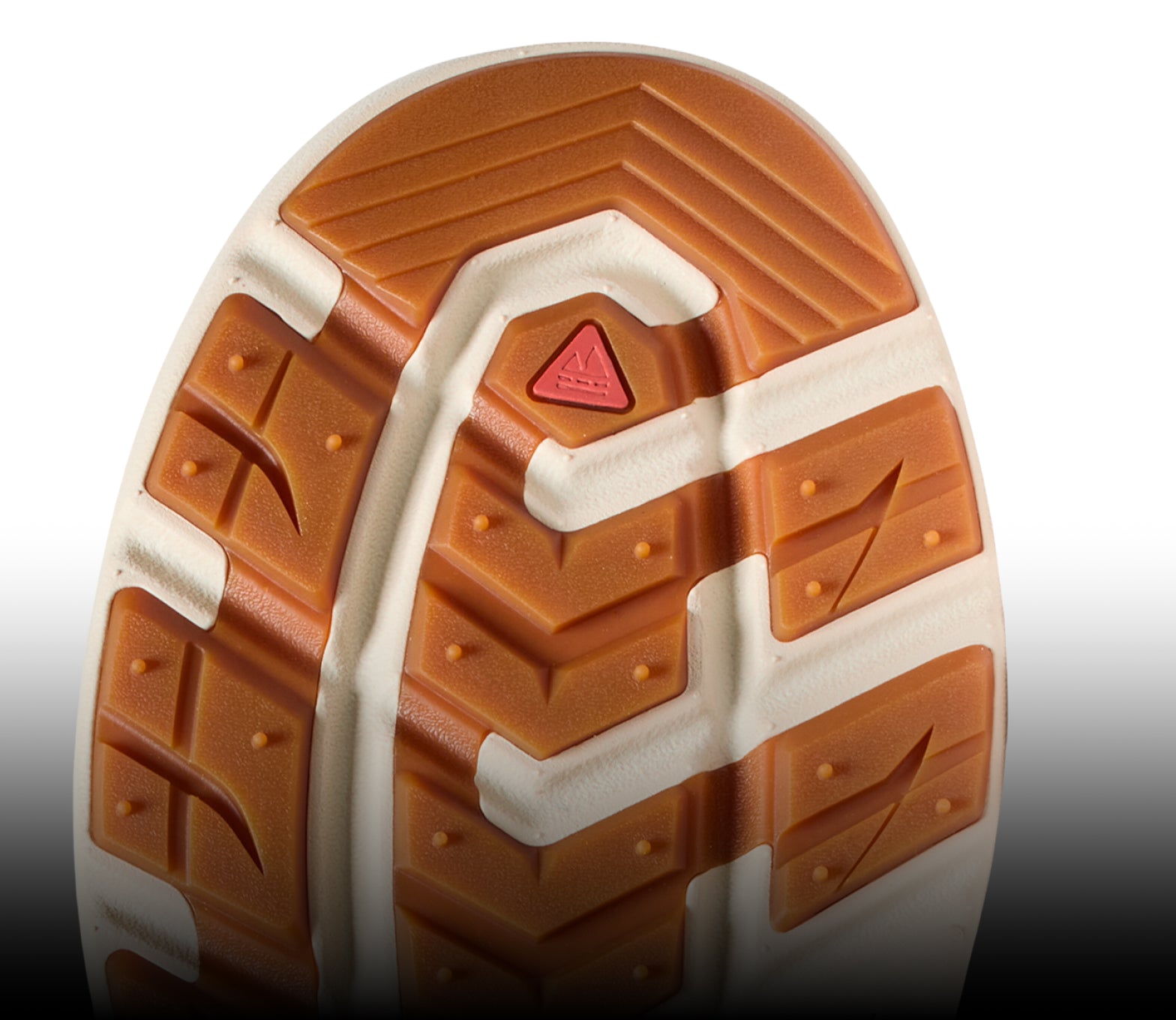 The white and brown undersole of a KEEN shoe.
