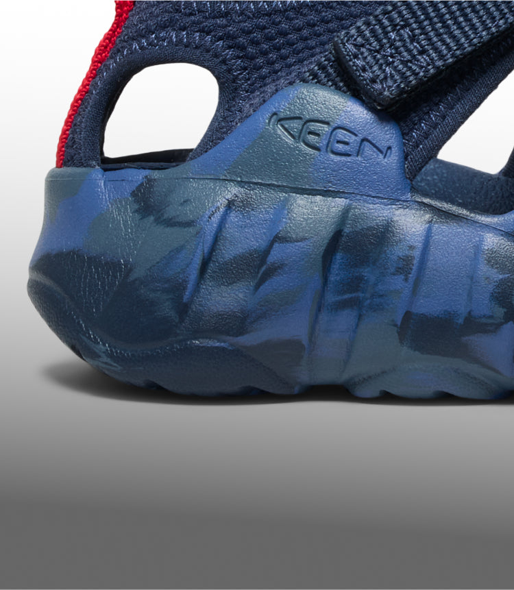 A close-up of the sole of a blue Hyperport H2 kids' sandal.