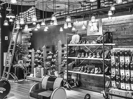 Black and white view of shelving display inside Palo Alto Keen garage. 