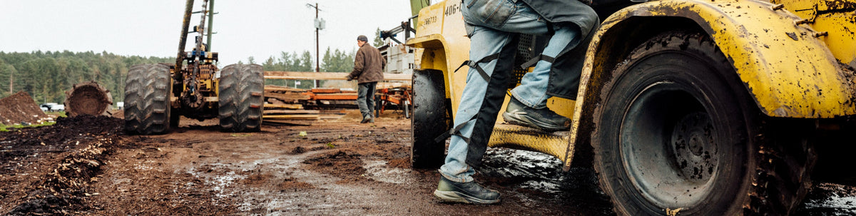 Close up image of light brown work boots on a job site