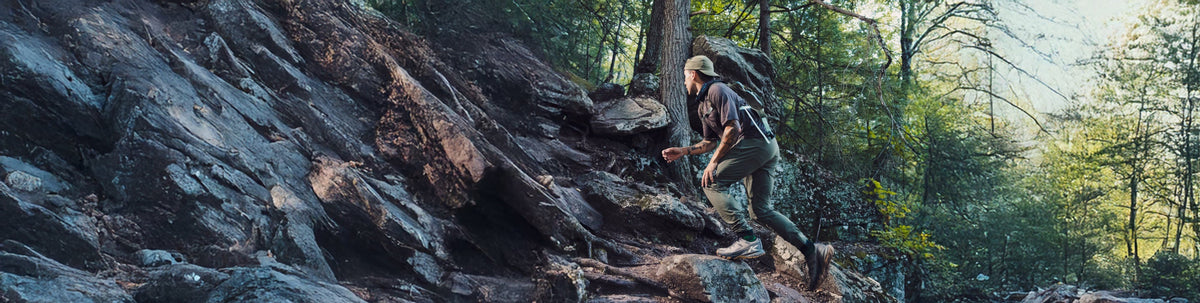 A banner image of people standing on a rock, wearing KEEN Day Hiking shoes, blurred to convey movement and speed.