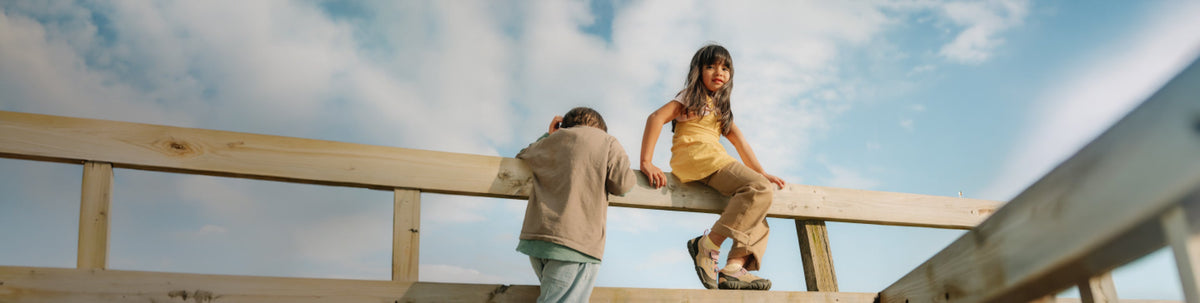 Kids on forest path with roots in new Wanduro shoes