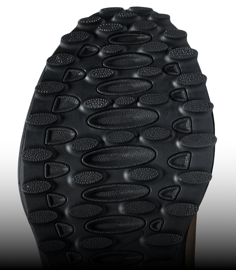 The underside of a KEEN shoe, displaying a black sole with good traction.