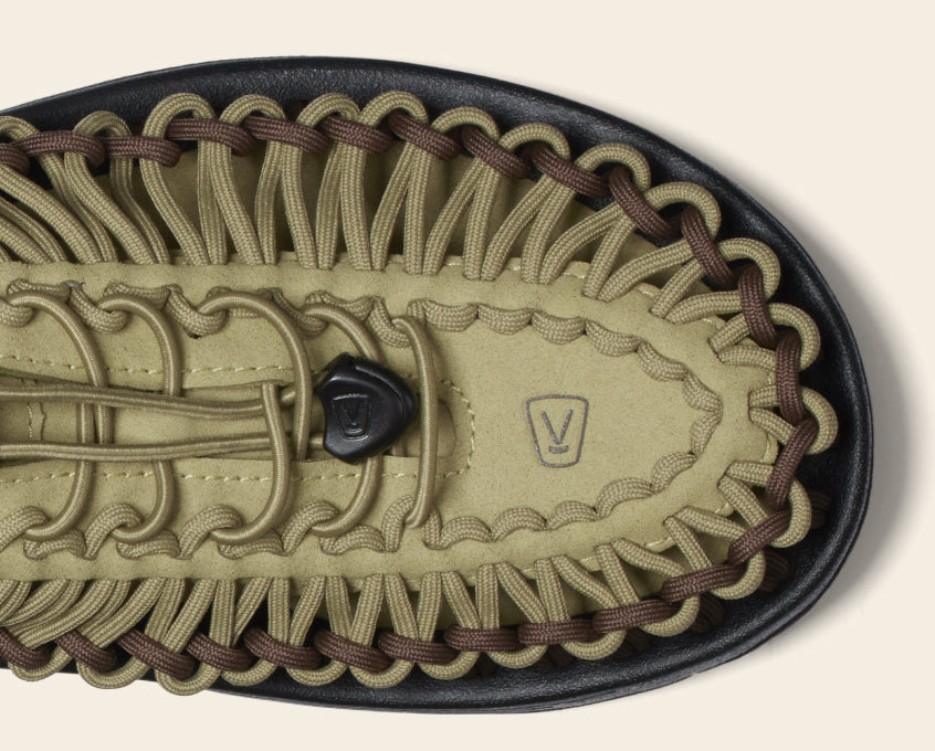 Close-up product shot of olive green and brown men's Uneek Sandal 