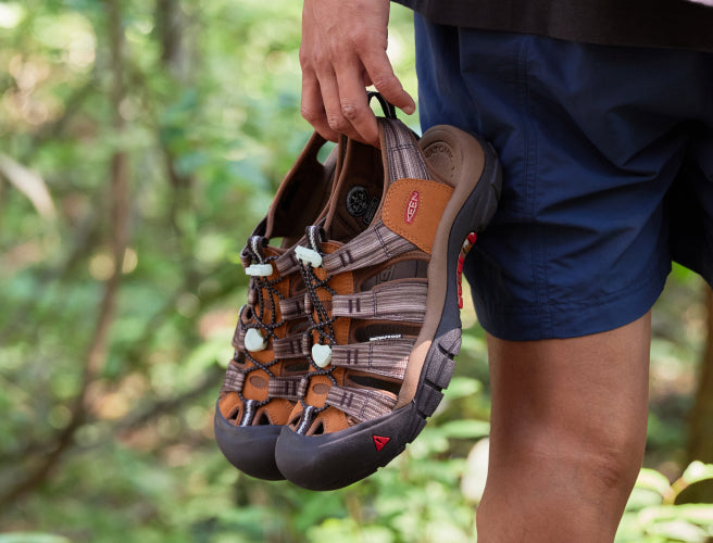 Person holding FujiRock and KEEN collaboration Newport Sandals
