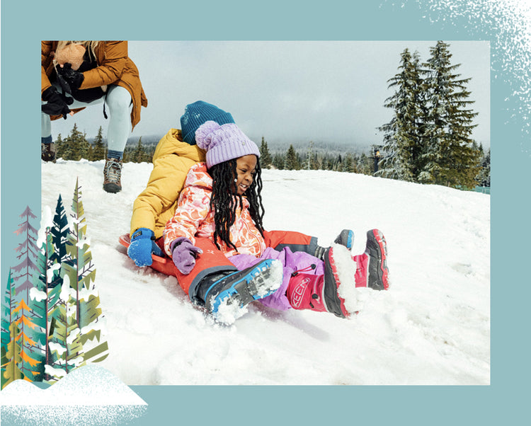 Little girl and boy sharing a sled and going down a snowy slope wearing snow troll boots