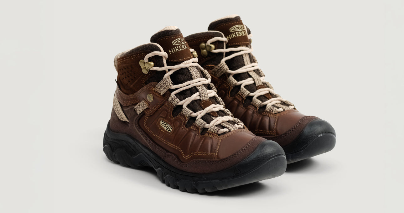 Product shot of brown leather a pair of Keen Collaboration hiking boot.
