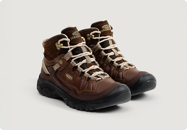 Product shot of brown leather a pair of Keen Collaboration hiking boot.