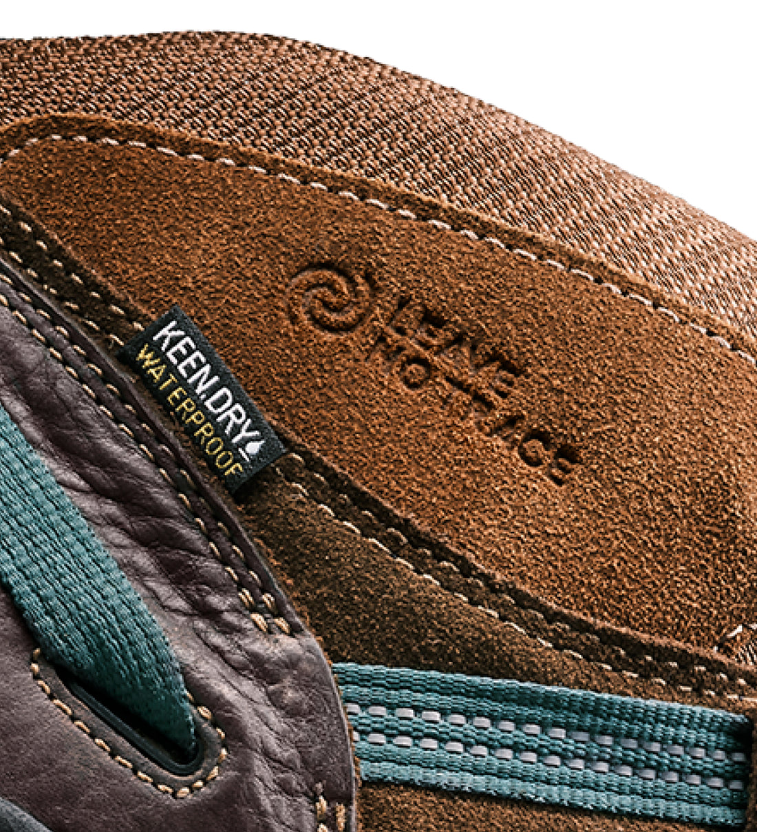 A close-up of the KEEN.DRY waterproof logo of a brown KEEN hiking boot.