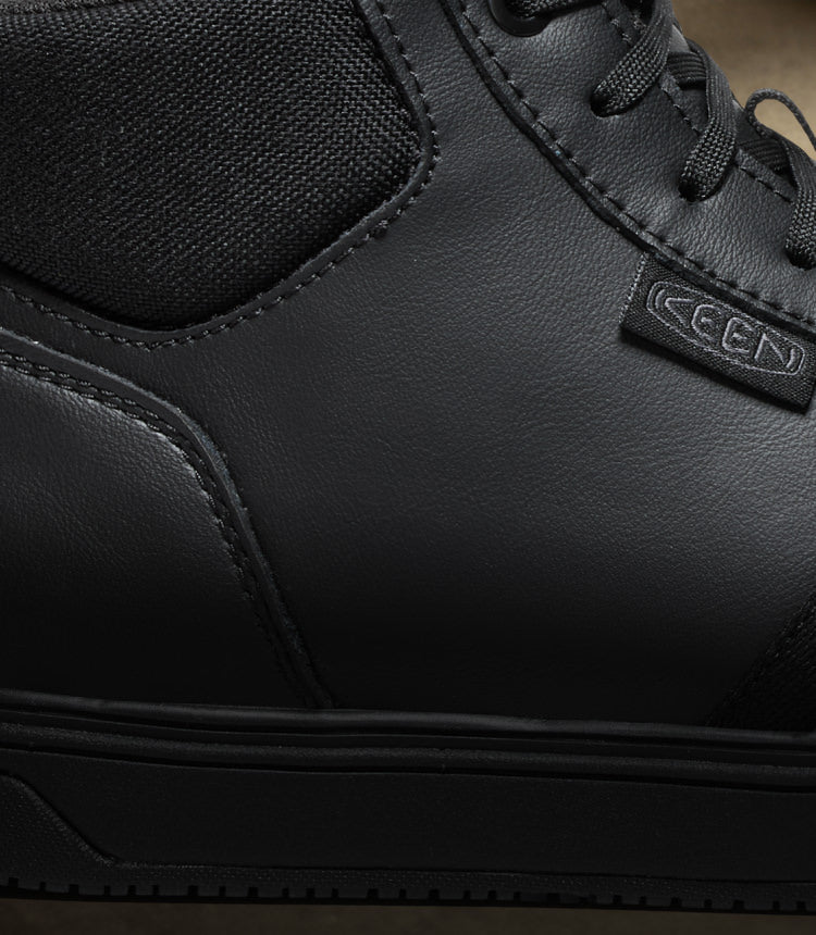 A close-up of a black KEEN Kenton work boot.