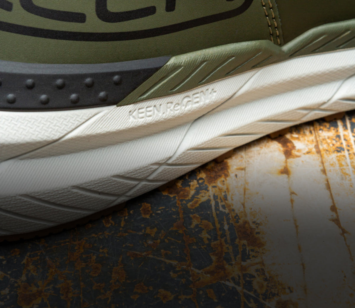 A close-up of the sole of a KEEN work shoe featuring Re.GEN technology.