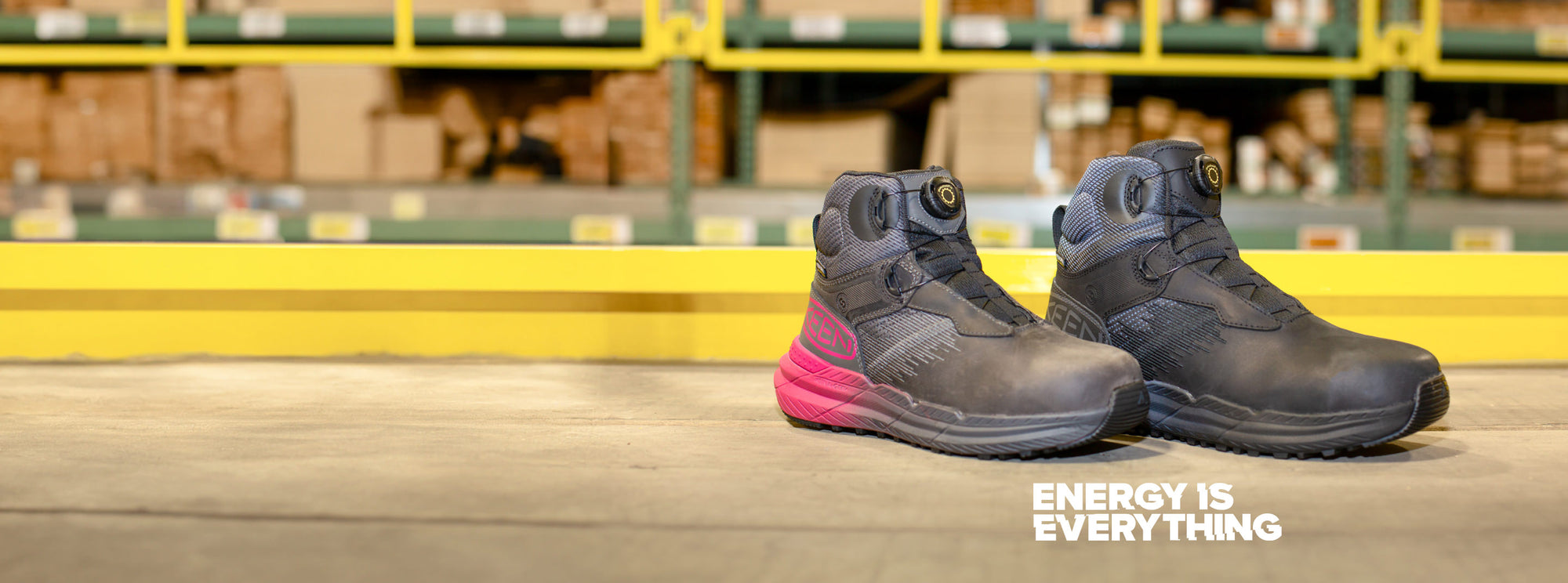 Product shot of men's and women's Snapline ratchetfit work boots in front of warehouse setting; embedded with text that reads "energy is everything"