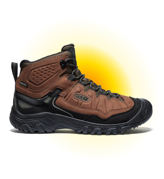 Product shot of men's brown leather Targhee hiking boot against white and yellow gradient background