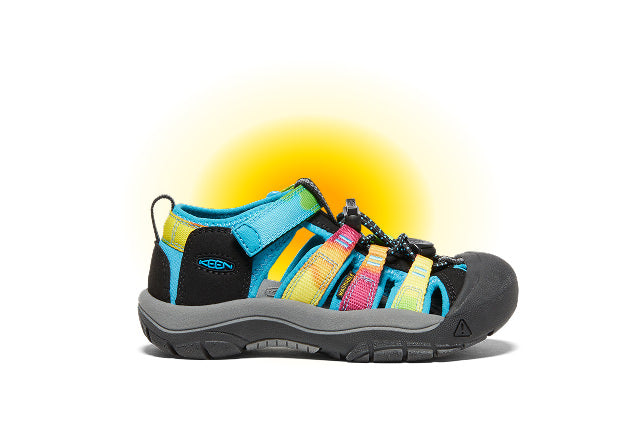 Product shot of kids' rainbow newport closed-toe sandal against white and yellow gradient background