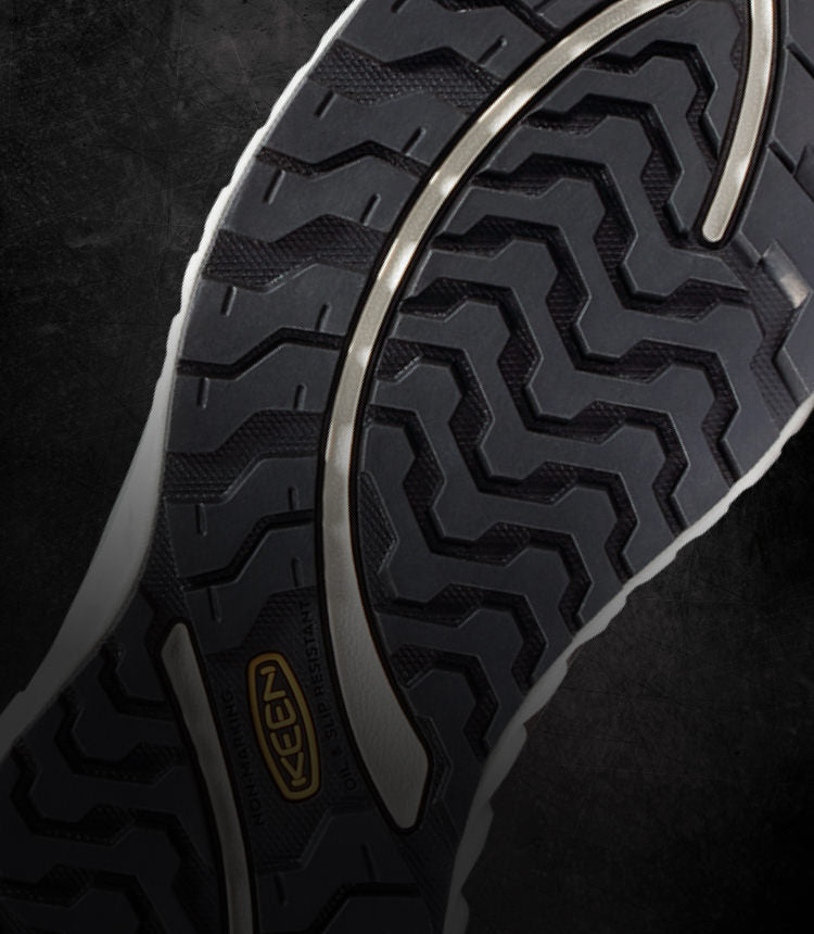 The black undersole of a KEEN work shoe.