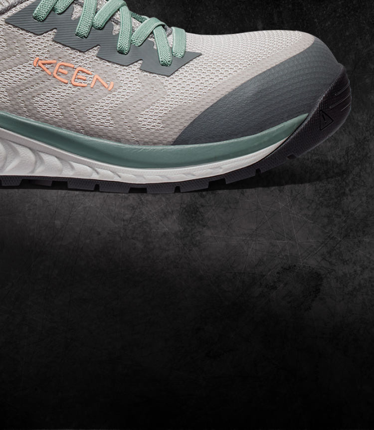 A teal, white, and grey KEEN work sneaker.
