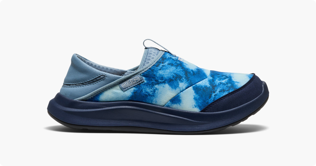 Product shot of men's slip-on Whyser shoe with bright blue gradient design