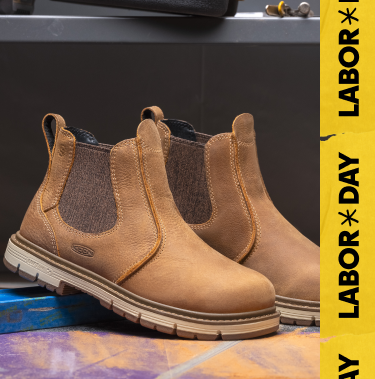 Product shot of women's brown chelsea work boot in warehouse setting. Embedded text reads "Labor Day" in yellow.