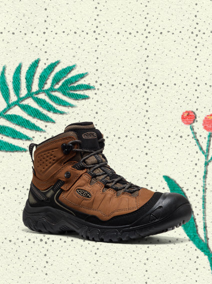 Product shot of brown leather hiking boot with rugged sole overlayed on vintage holiday wrapping paper
