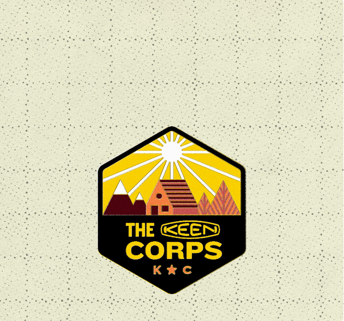The KEEN Corps logo, characterized by sleek typography and a vibrant, modern graphic that features a cabin, mountains, and sun.