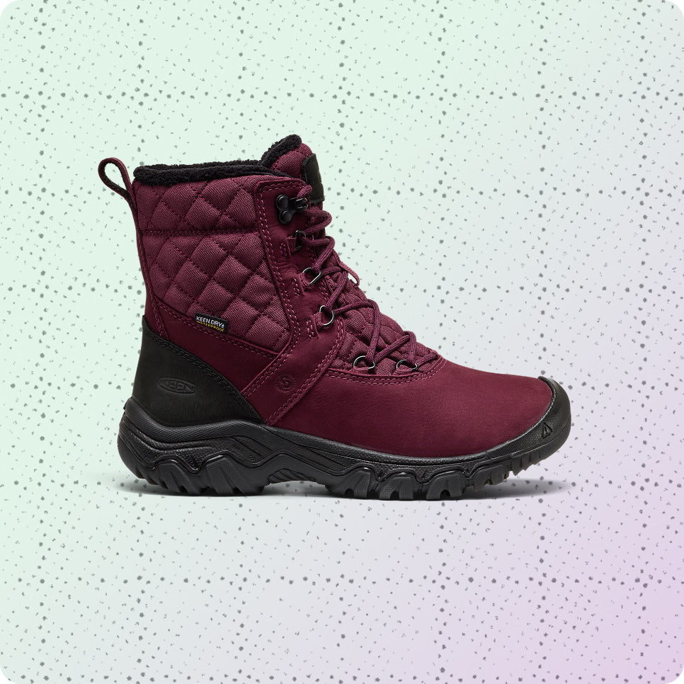 Womens red, insulated and waterproof winter boot on a dotted grid wrapping-paper background.