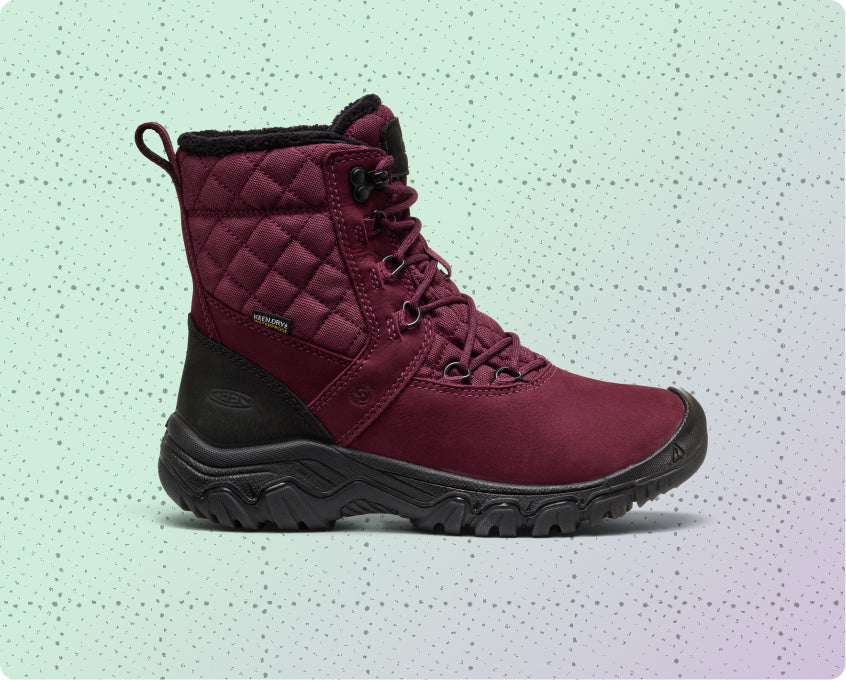Womens red, insulated and waterproof winter boot on a dotted grid wrapping-paper background.
