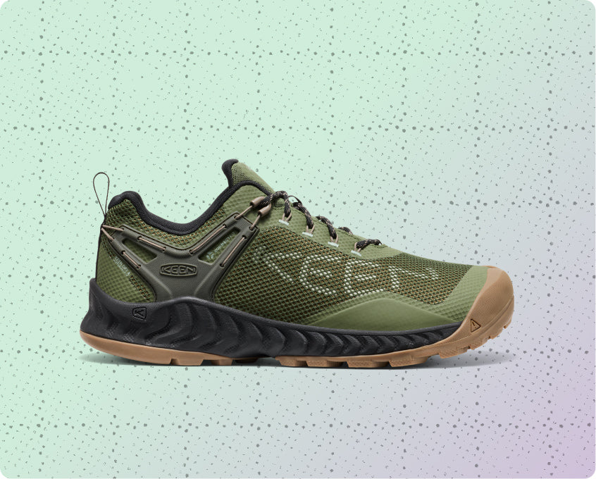 Men's green, lightweight and waterproof hiking shoe on a dotted grid wrapping-paper background.