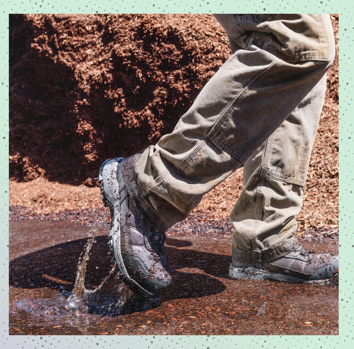 Man walking through mud wearing Skokie work boots