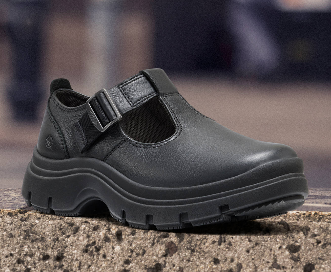 Elegant black leather Kosa mary jane with a side buckle for added style and support.