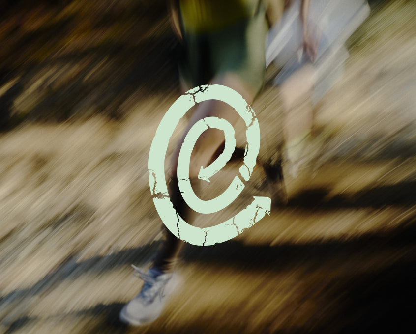 Eco Enhanced logo embedded over blurred image of two trail runners.