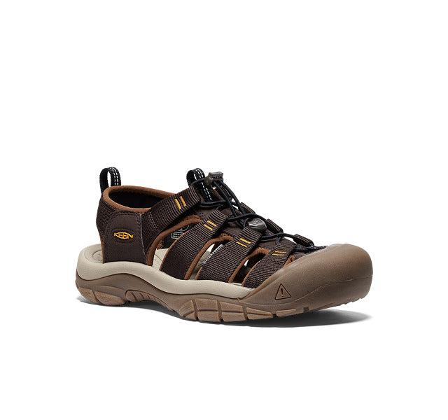 Studio shot of mens brown and tan Newport water sandal with closed toe protection. 