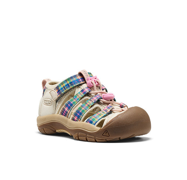 Studio shot of a little kids' newport shoe with plaid detail and pink bungee laces. 