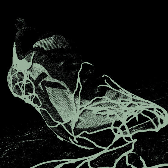 Green-scaled photo of shoe with green roots growing up the toe where it touches the ground