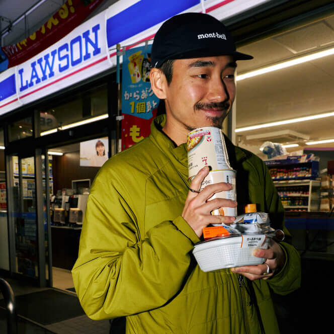 Man walking outside of convenience store holding post run snacks