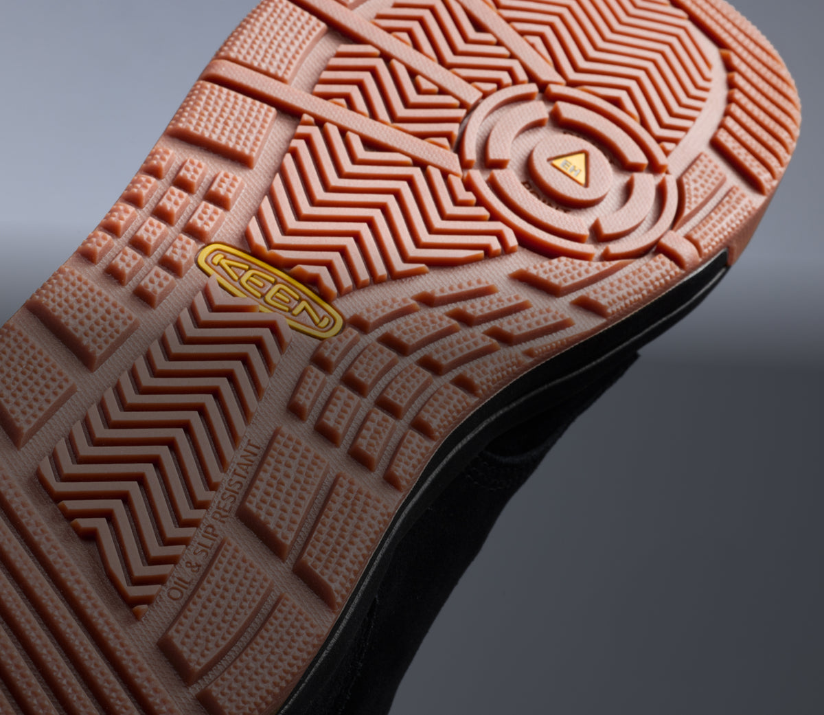 A close-up of the under-sole of a KEEN work sneaker.