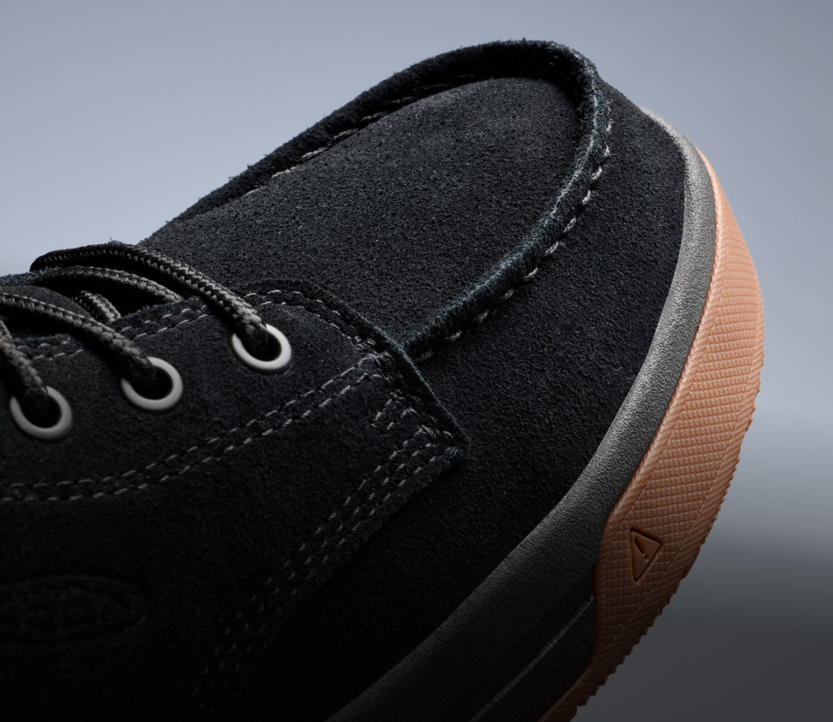 A close-up of the toe of a black Gibson work boot.