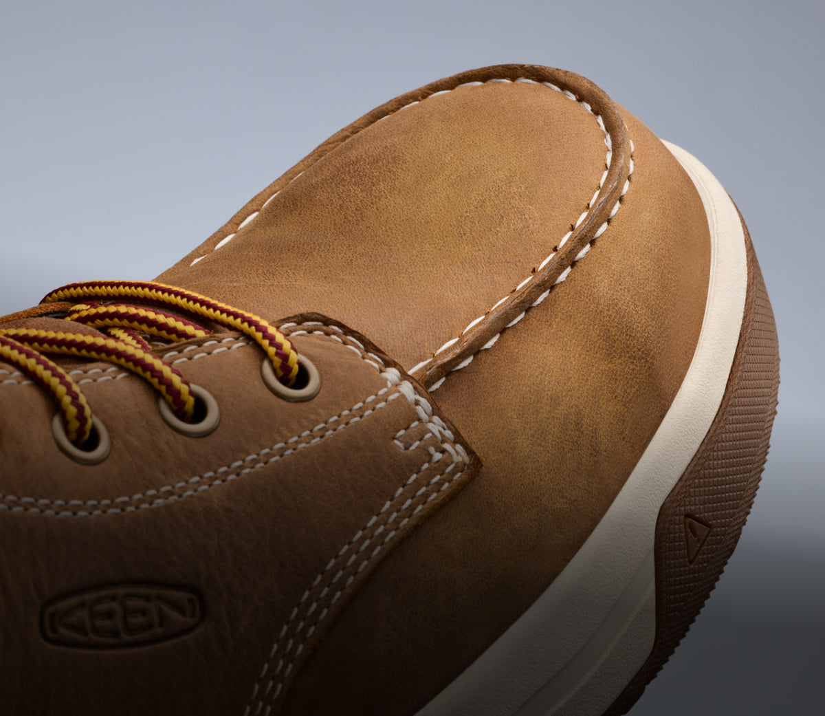 A close-up of the front of a brown Gibson work boot.