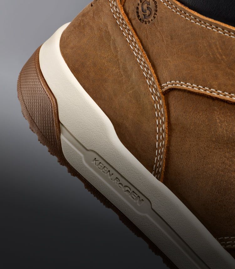 A close-up of the KEEN.ReGen sole of a brown Gibson work boot.